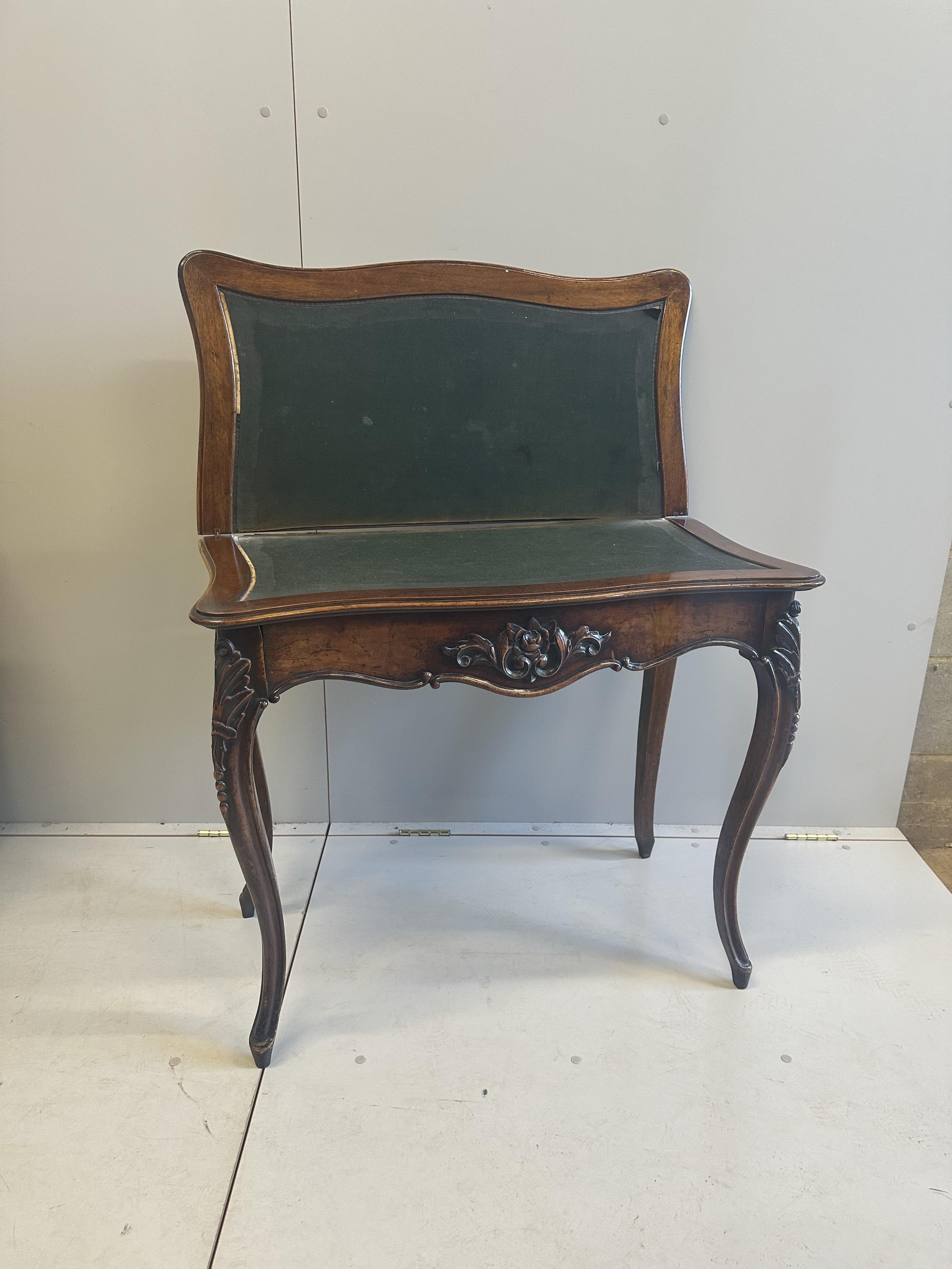 A Victorian burr walnut serpentine folding card table, width 84cm, depth 42cm, height 73cm